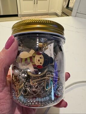 Gold-Lid Jar of Mixed Jewelry Charms Q